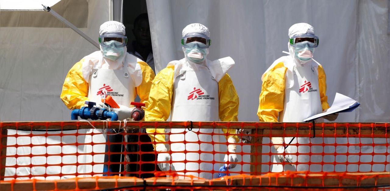 Health workers dressed in protective suits are seen at the newly constructed MSF(Doctors Without Borders) Ebola treatment centre in Goma, Democratic Republic of Congo. Credit: Reuters Photo