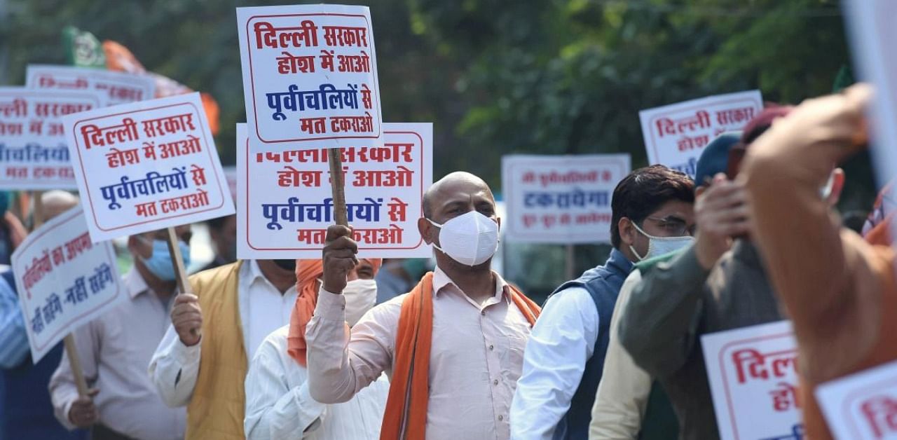 Bharatiya Janata Party (BJP) workers stage a protest against the ban on Chhath Pooja events, outside the residence of Delhi Chief Minister Arvind Kejriwal in New Delhi. Credit: PTI Photo