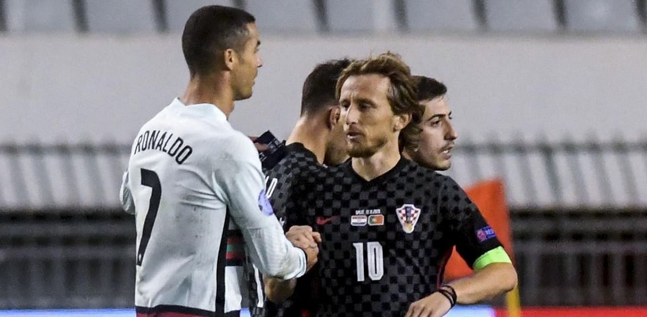 Portugal's midfielder Cristiano Ronaldo (L) greets Croatia's midfielder Luka Modric at the end of the UEFA Nations League A Group 3 football match between Croatia and Portugal. Credit: AFP Photo