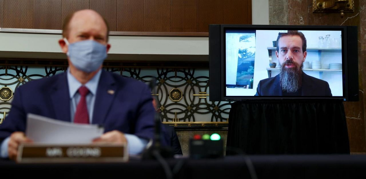 Twitter CEO Jack Dorsey is seen testifying remotely via videoconference as US Senator Chris Coons (D-DE) listens during a Senate Judiciary Committee. Credit: Reuters Photo