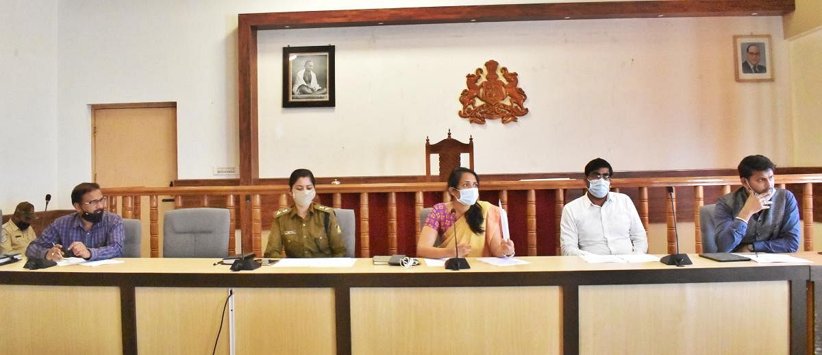 Deputy Commissioner Annies Kanmani Joy speaks at a meeting in Madikeri on Wednesday.