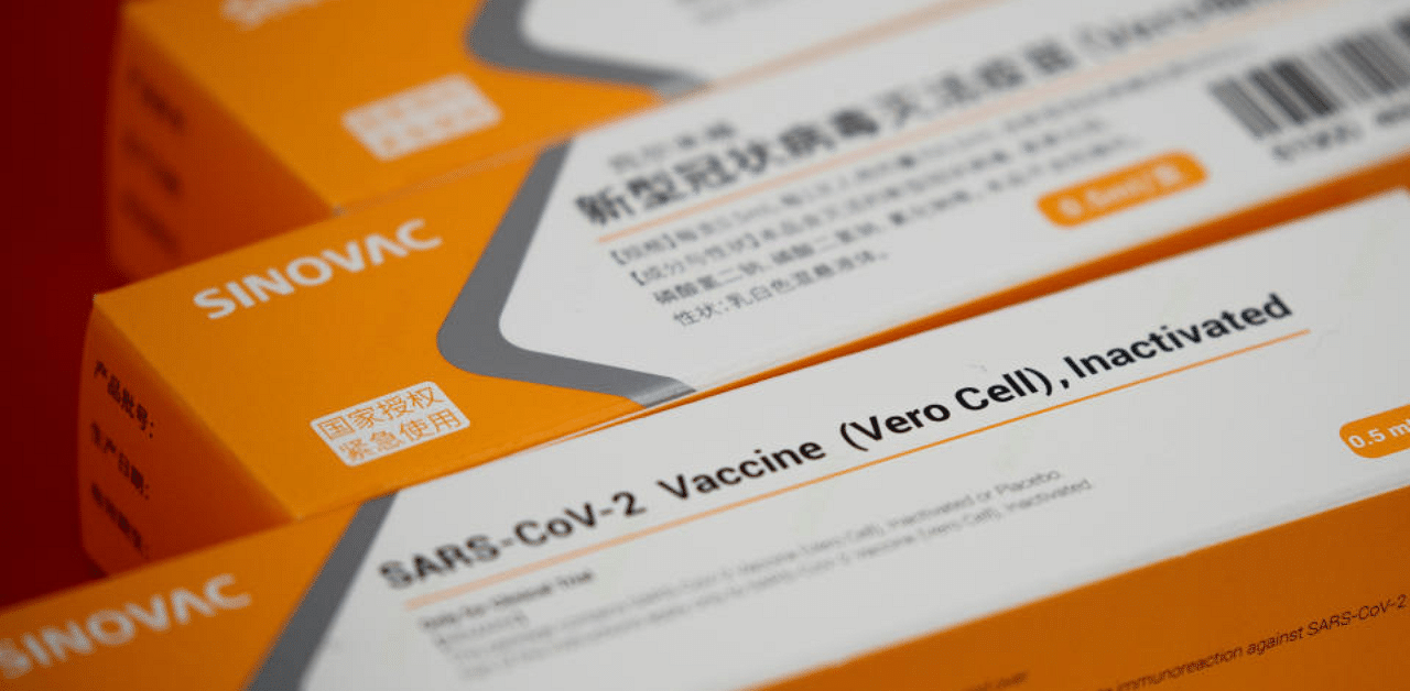 A display shows packages of vaccine candidate for SARS-CoV-2 by Sinovac Biotech during a government-organized media tour showcasing the company's development of a coronavirus disease vaccine candidate in Beijing, China, September 24, 2020. Credit: Reuters File Photo