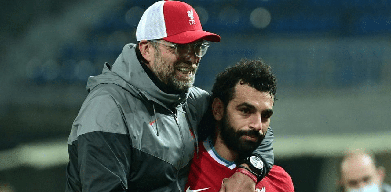 Liverpool's German manager Jurgen Klopp (L) with Liverpool's Egyptian midfielder Mohamed Salah. Credit: AFPN Photo