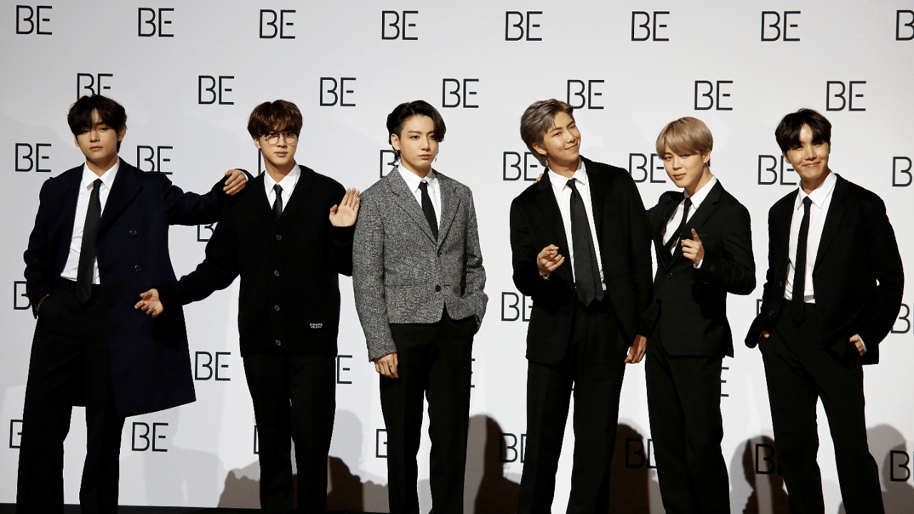Members of K-pop boy band BTS pose for photographs during a news conference promoting their new album "BE(Deluxe Edition)" in Seoul. Credit: Reuters Photo