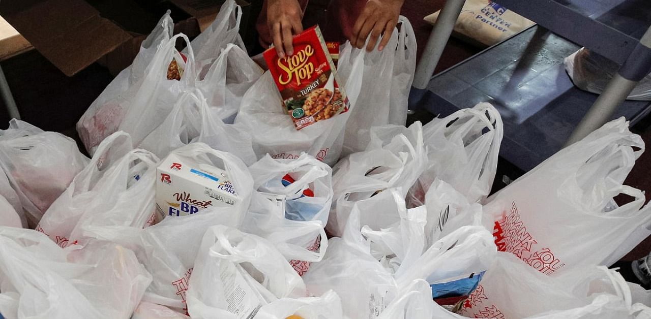 Bags of free holiday food and Thanksgiving turkeys. Credit: Reuters Photo