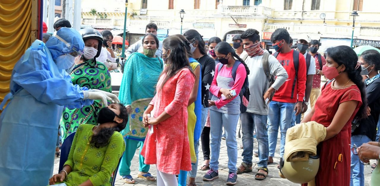 College students being subjected to Covid test in Mysuru. Credit: DH file photo.