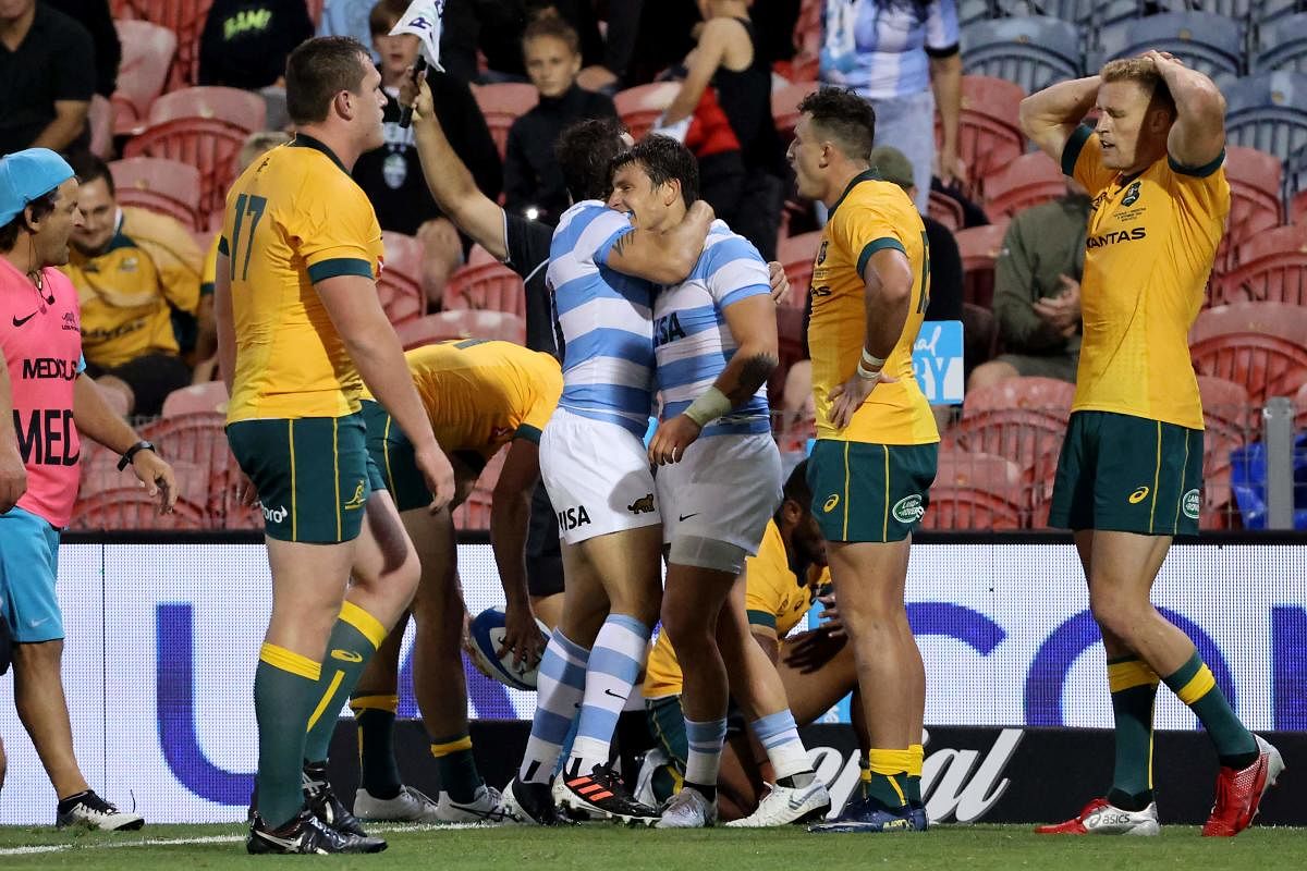 Argentina (C) and Australian players react at the end of the 2020 Tri-Nations rugby match between the Australia and Argentina at McDonald Jones Stadium in Newcastle on November 21, 2020. Credit: AFP