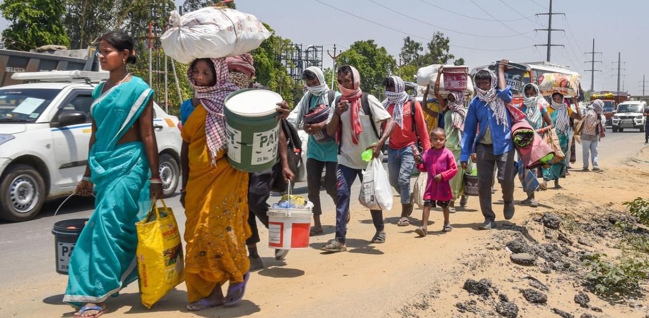 Lakhs of migrant labourers had to walk back to their village due to absence of food, shelter and income during the lockdown. Credit: PTI Photo