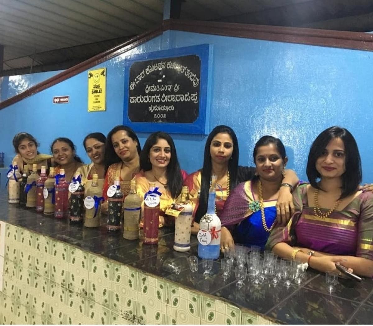 Kodava women pose with the wine they have prepared. Photo credit: M Sabitha