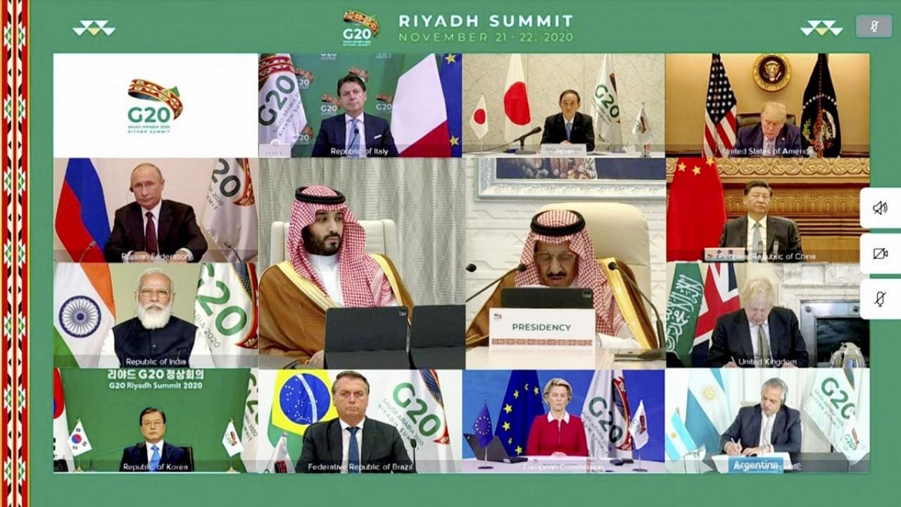 Saudi Arabia’s King Salman delivers his speech at the opening session of G20 Summit. PM Narendra Modi is also seen. Credit: PTI/Twitter/@Saudi_Gazette.