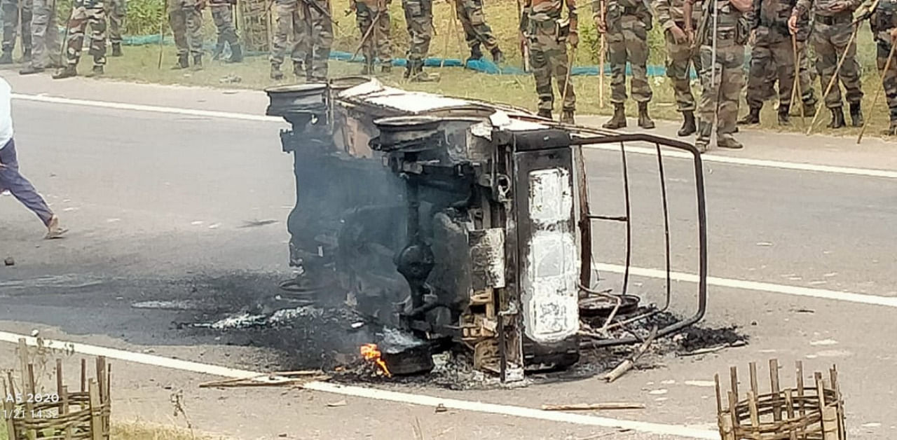 Vehicles set on fire during the highway blockade in Panisagar sub-division in Tripura. Credit: DH Photo