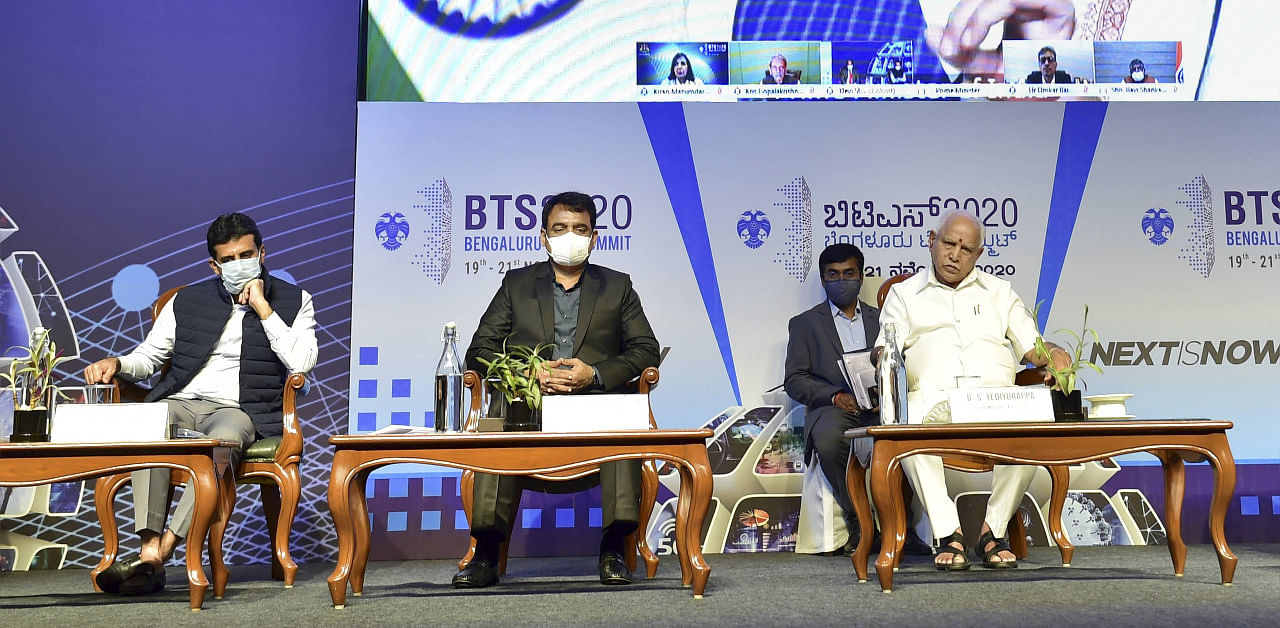 Karnataka Chief Minister B S Yediyurappa, his deputy CN Ashwath Narayan, Minister Jagadish Shettar (R) and MLA Rizwan Arshad(L) listen to PM Modi during Bengaluru Tech Summit on Thursday. Credit: PTI Photo