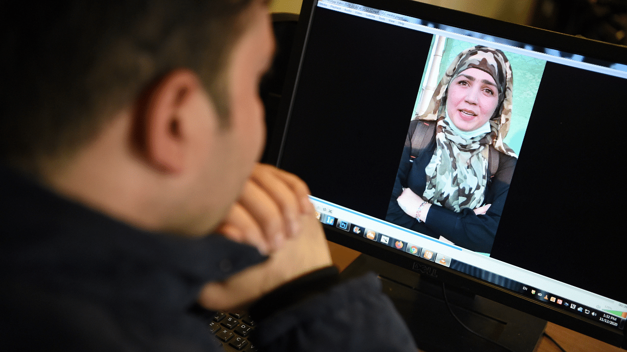 fghan woman Muzghan, who walked free from jail in September after confessing to being members of the Taliban's ultra-violent Haqqani network, on a computer screen in Kabul. Credit: AFP Photo