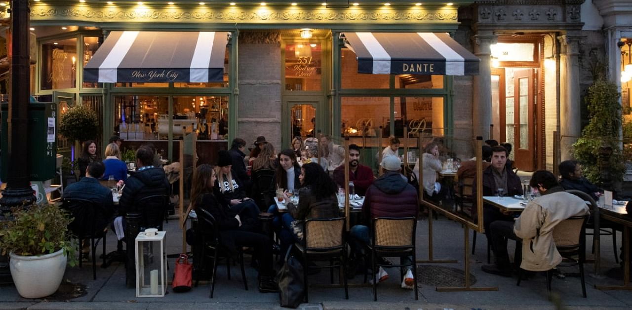 People enjoy outdoor dining as the spread of the coronavirus disease continues, in New York City. Credit: Reuters Photo