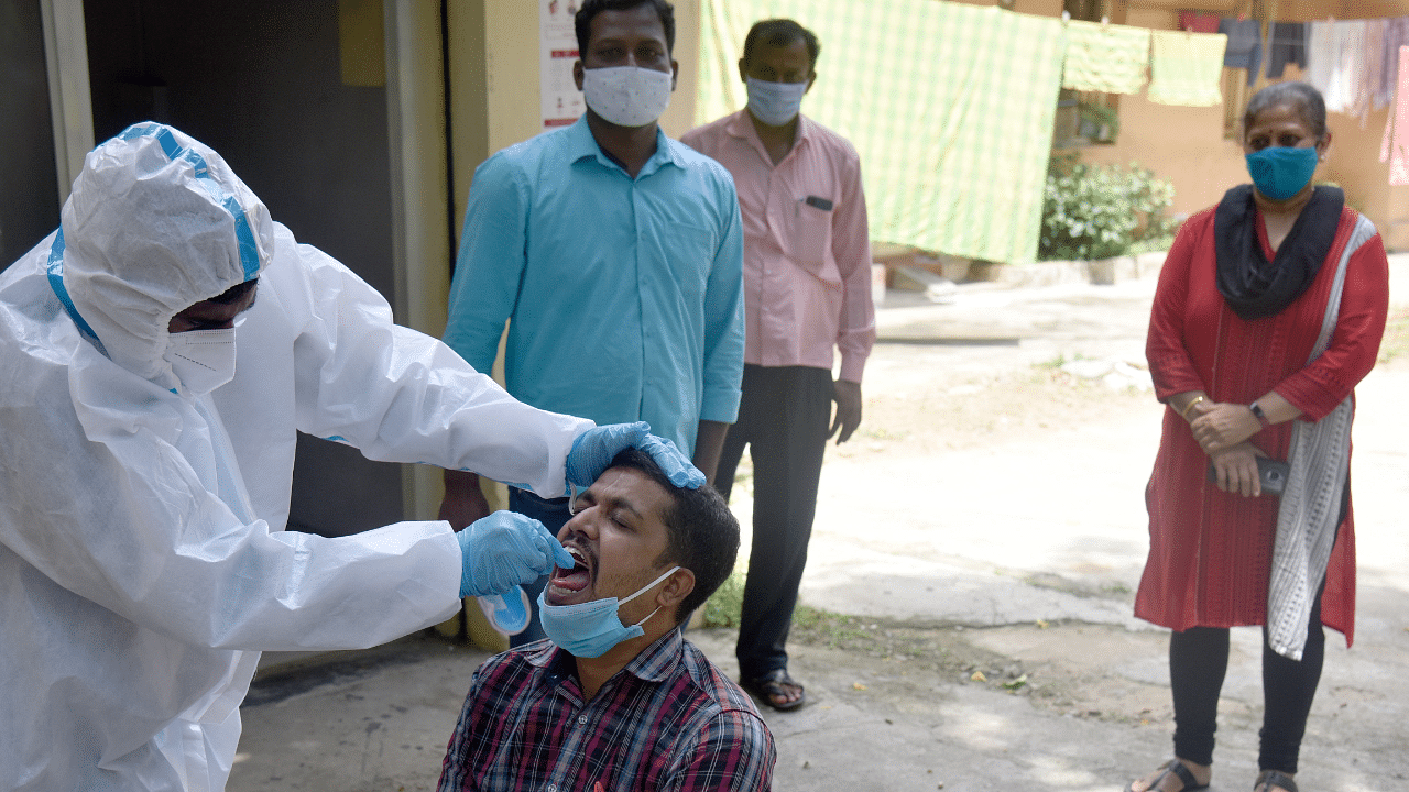 Health staff conducting Coronavirus test at Covid 19 lockdown unlock 04 relief free checkup. Credits: DH Photo