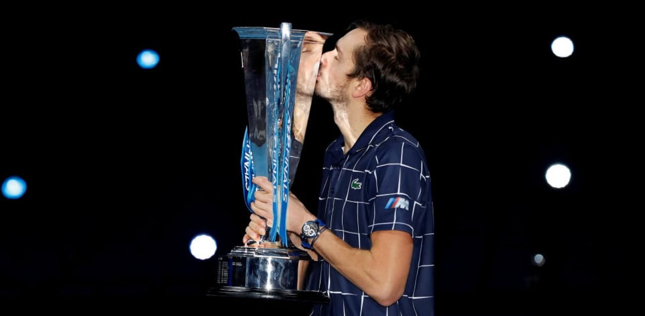 Russia's Daniil Medvedev kisses the trophy as he celebrates winning the final match against Austria's Dominic Thiem. Credit: Reuters Photo