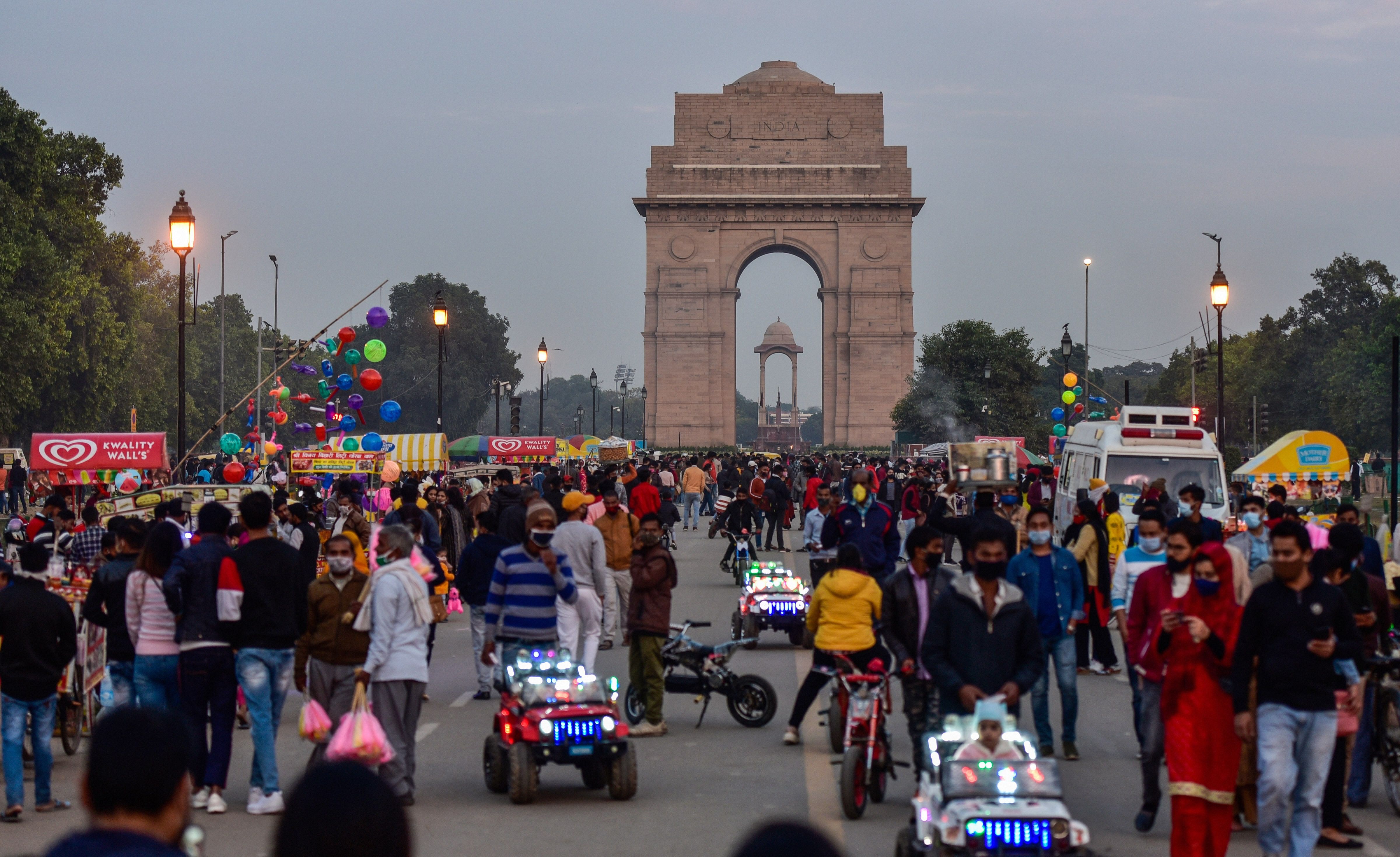 People visit the India Gate at Rajpath, amid the ongoing coronavirus pandemic. Credit: PTI Photo