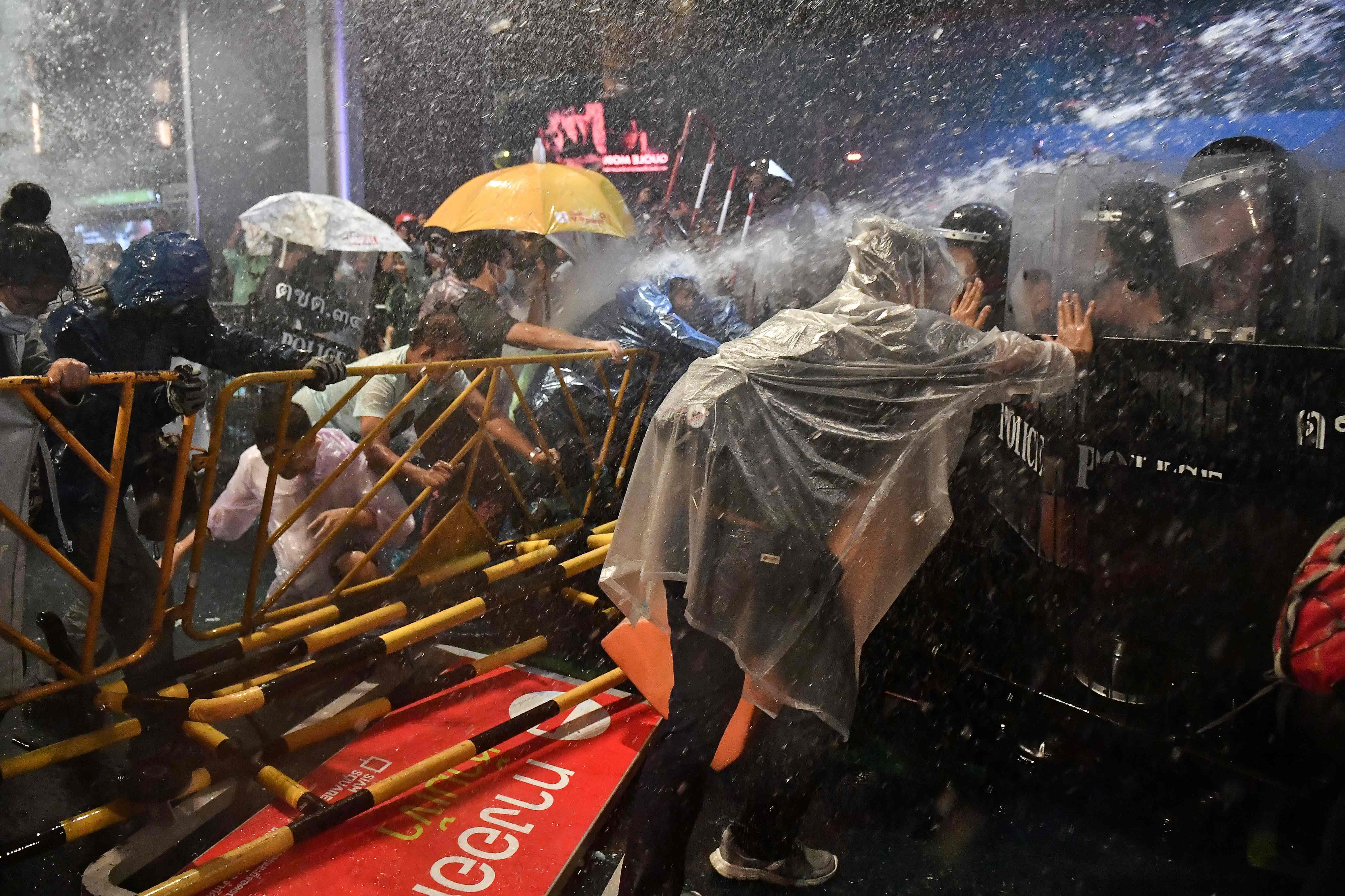Police fire water cannons at pro-democracy protesters during an anti-government rally in Bangkok. Credit: AFP Photo