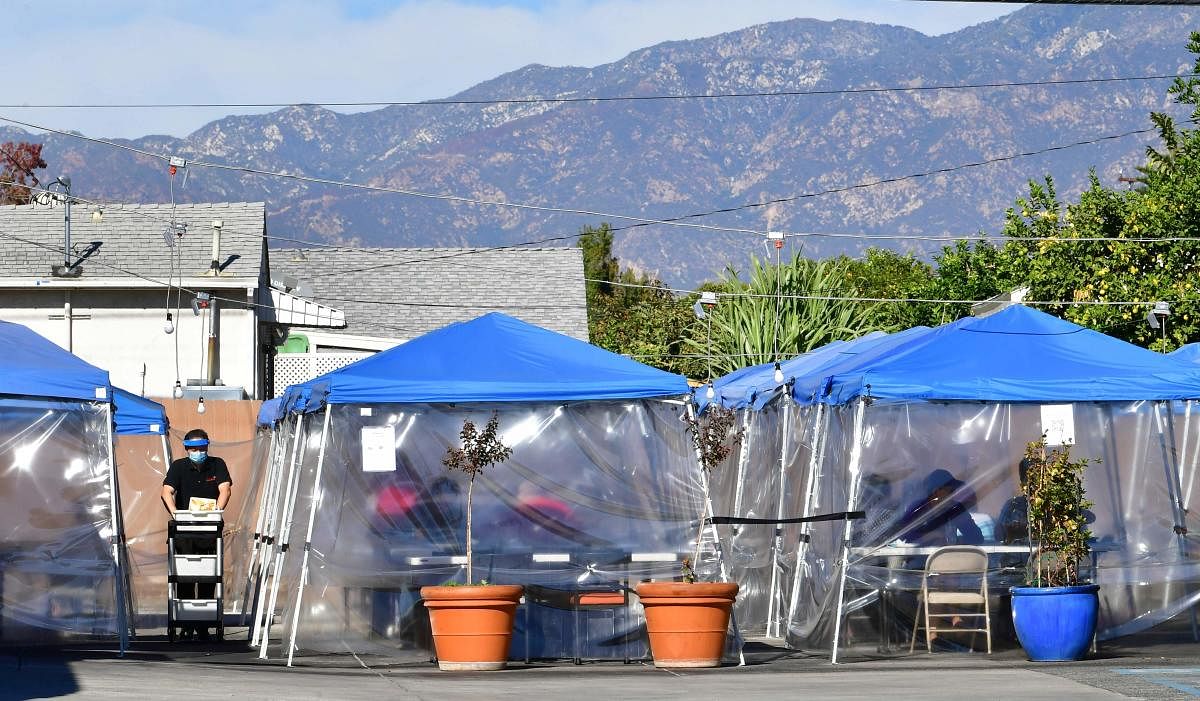 Tents for outdoor dining are seen in a restaurant's parking lot in California. Credit: AFP