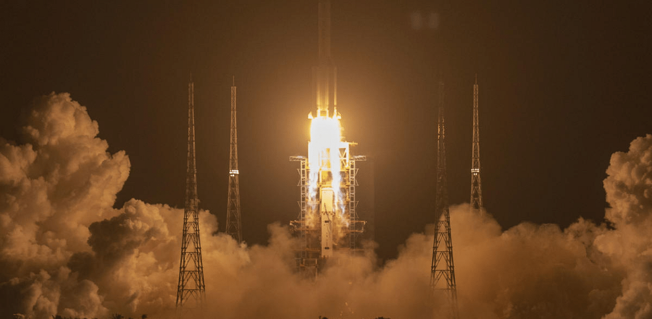 A Long March-5 rocket carrying the Chang'e 5 lunar mission lifts off at the Wenchang Space Launch Center in Wenchang in southern China's Hainan Province. Credit: AP Photo
