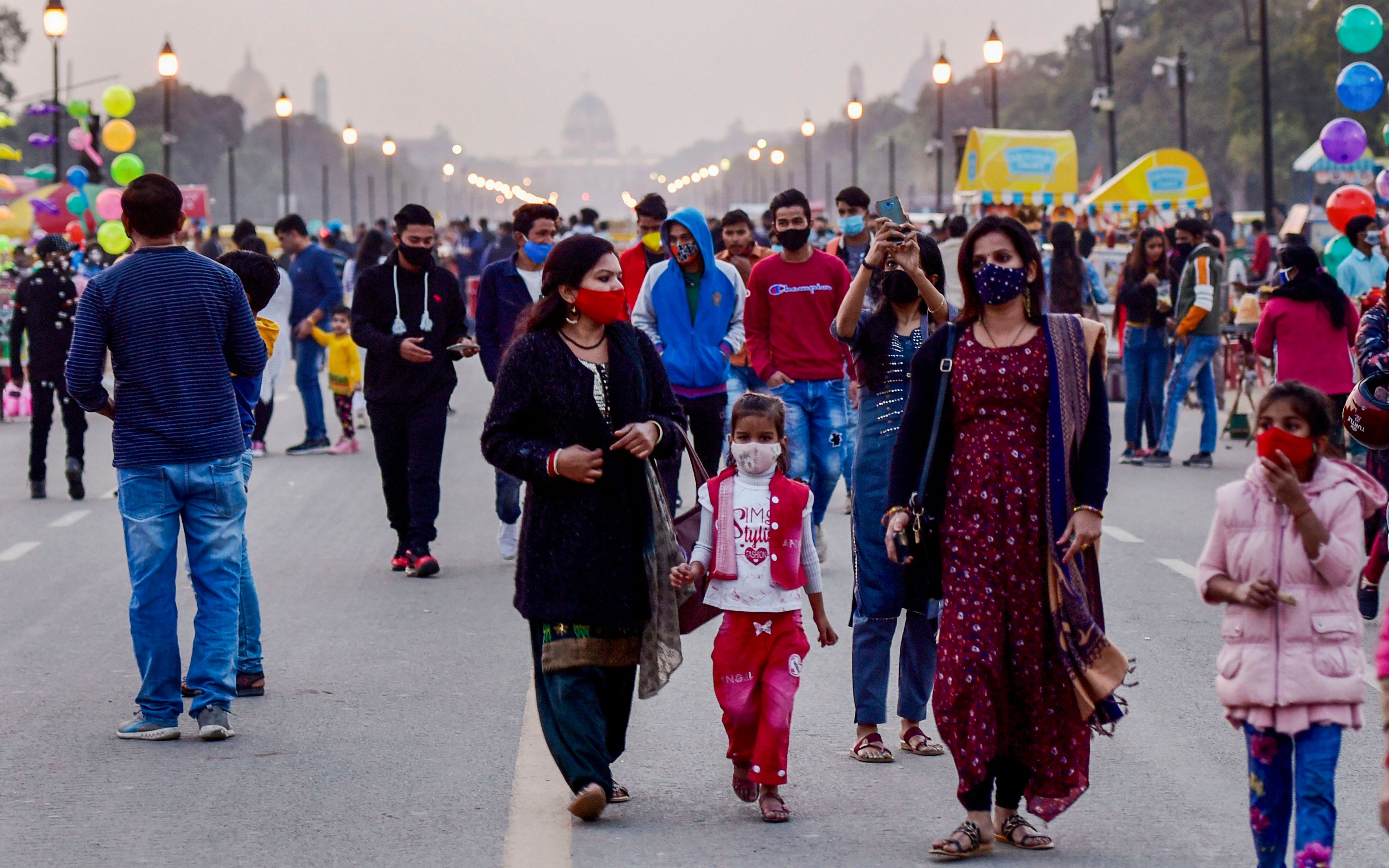 People visit the India Gate at Rajpath, amid the ongoing coronavirus pandemic, in New Delhi. Credit: PTI Photo