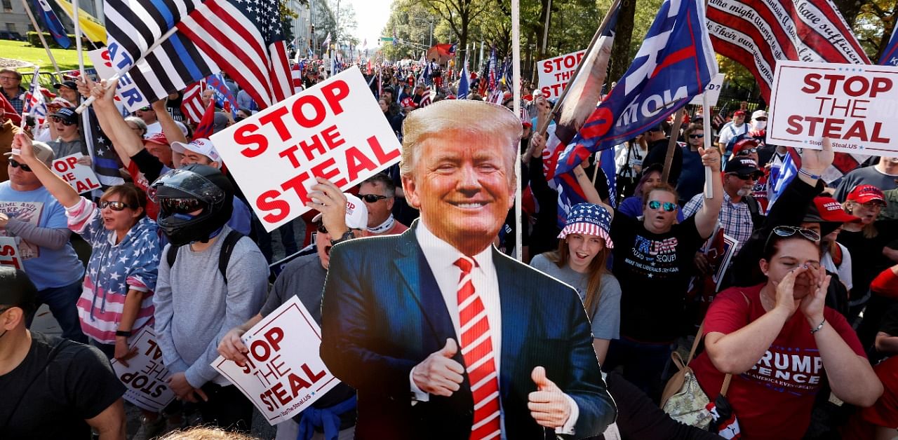 A cutout of US President Donald Trump is pictured as supporters take part in a protest against the results of the 2020 US presidential election in Atlanta, Georgia. Credit: Reuters Photo