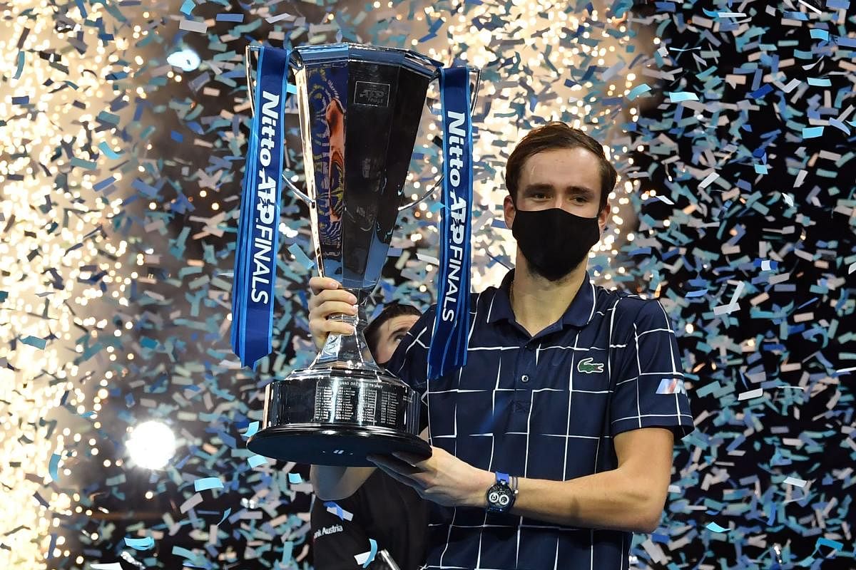 Medvedev with the winner's trophy after his 4-6, 7-6, 6-4 win over Austria's Dominic Thiem in their men's singles final match on day eight of the ATP World Tour Finals tennis tournament at the O2 Arena in London. Credit: AFP