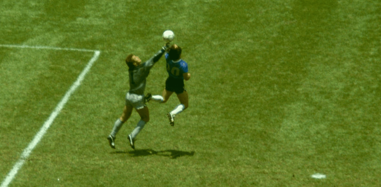  Argentina player Diego Maradona outjumps England goalkeeper Peter Shilton to score with his 'Hand of God' goal during the 1986 FIFA World Cup Quarter Final at the Azteca Stadium on June 22, 1986 in Mexico City, Mexico. Credit: Getty Images