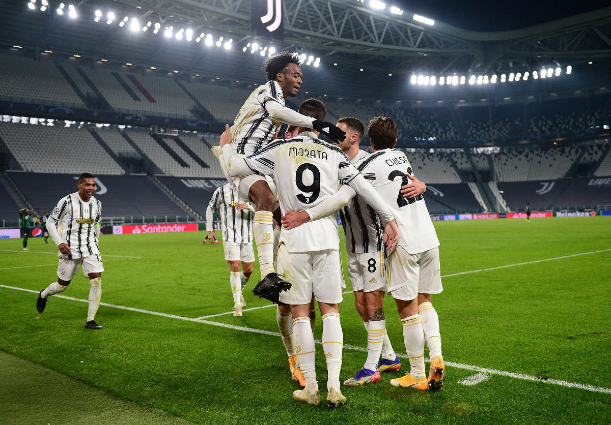 Juventus' Alvaro Morata celebrates scoring their second goal with teammates. Credit: Reuters photo. 