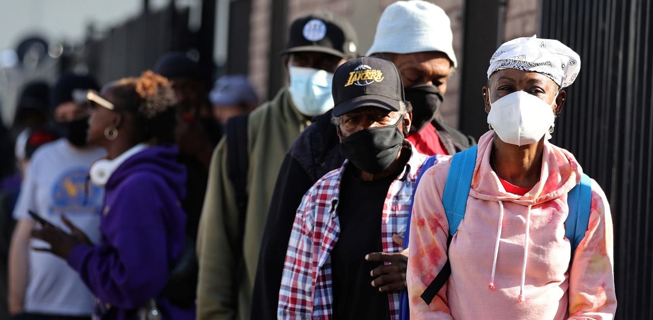 People wait in line for a Los Angeles Mission homeless shelter Thanksgiving meal giveaway, amid the global outbreak of the coronavirus. Credit: Reuters Photo