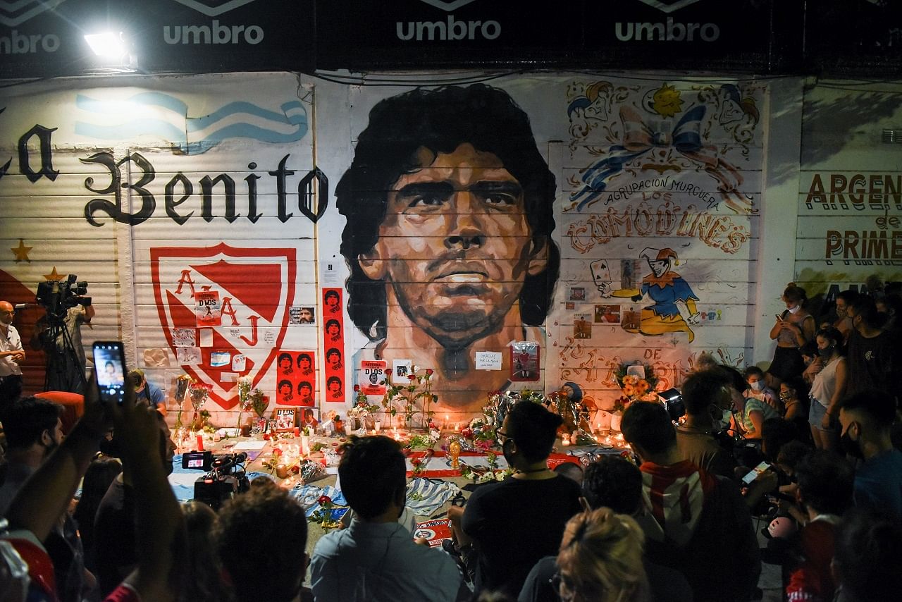 People gather to mourn the death of soccer legend Diego Maradona, outside the Diego Armando Maradona stadium, in Buenos Aires. Credit: Reuters Photo