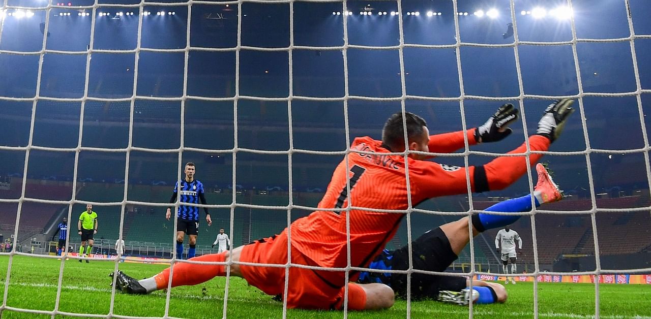 Inter Milan's Slovenian goalkeeper Samir Handanovic concedes the second goal during the UEFA Champions League Group B football match Inter Milan vs Real Madrid. Credit: AFP Photo