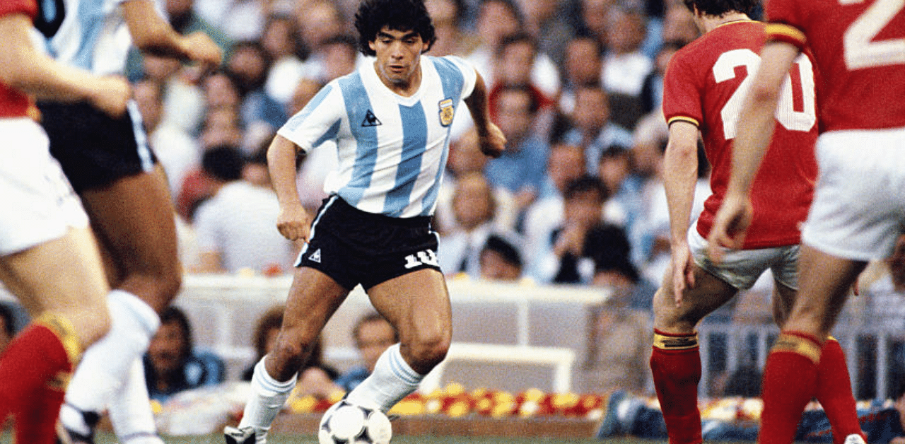 Argentina player Diego Maradona (c) takes on the Belguim defence during the 1982 FIFA World Cup match between Argentina and Belguim at the Nou Camp stadium on June 13, 1982 in Barcelona, Spain. Credit: Getty Images