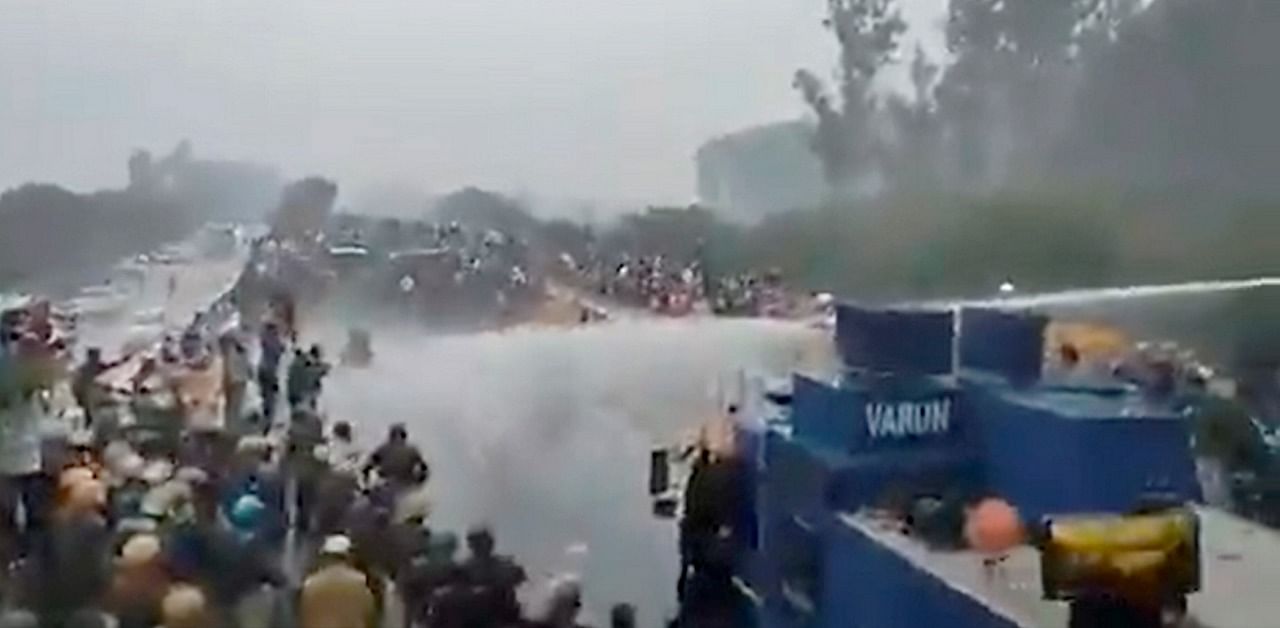 Water cannons being deployed on protestors during a farmers march towards Delhi against the farm reform bills, in Kurukshetra. Credit: PTI Photo/Twitter