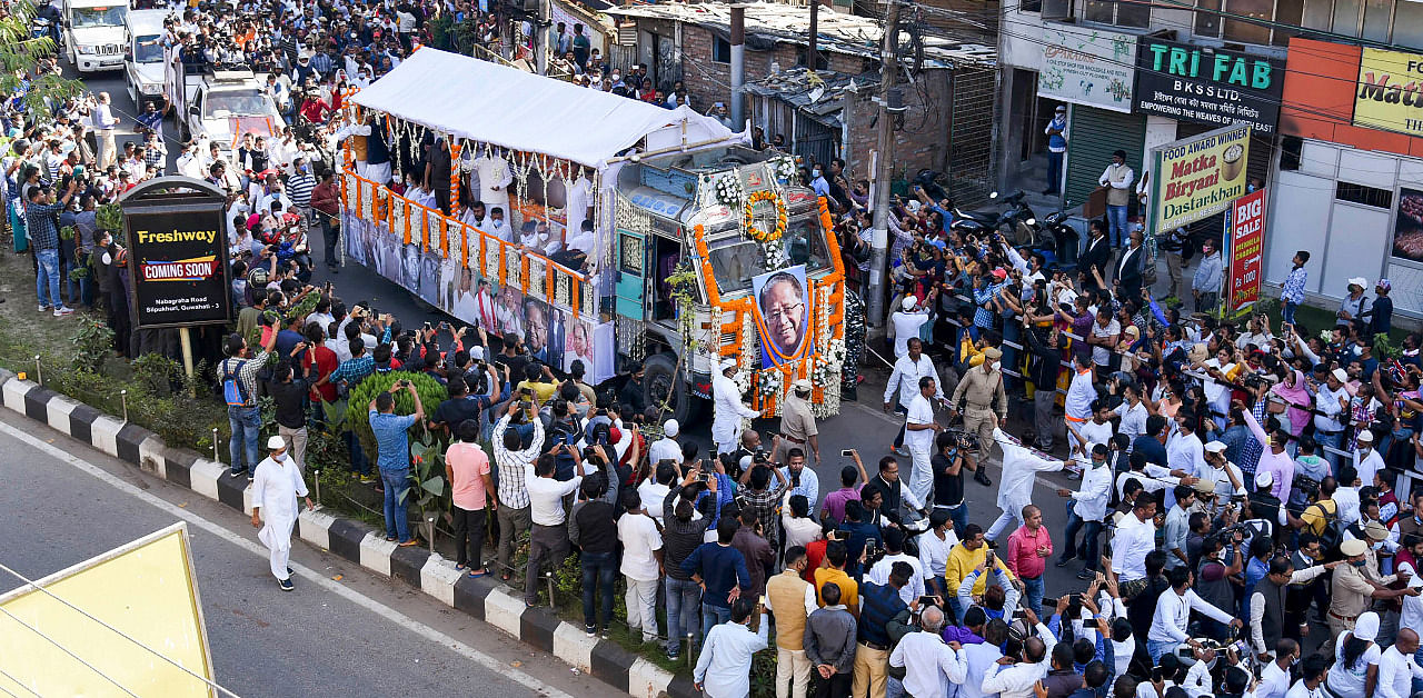People gather in large numbers to pay their respect to former Assam chief minister Tarun Gogoi as his funeral moves along a road, in Guwahati. Credit: PTI Photo