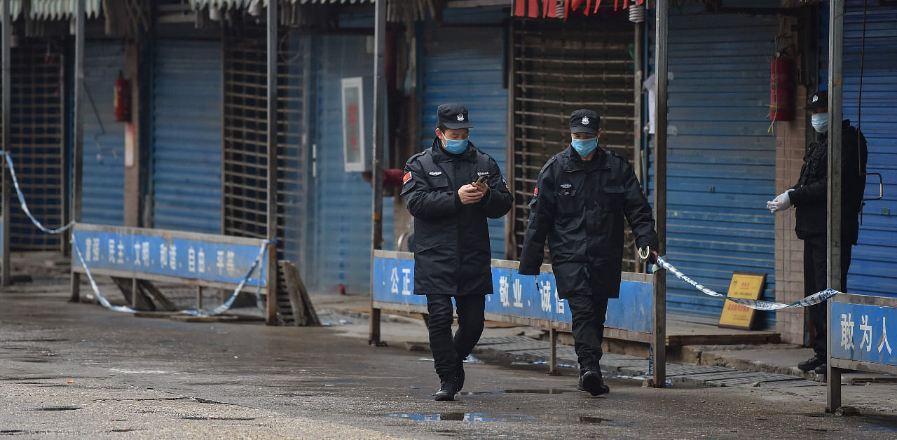Security guards patrol outside the Huanan Seafood Wholesale Market in Wuhan on January 24, 2020. Credit: AFP Photo
