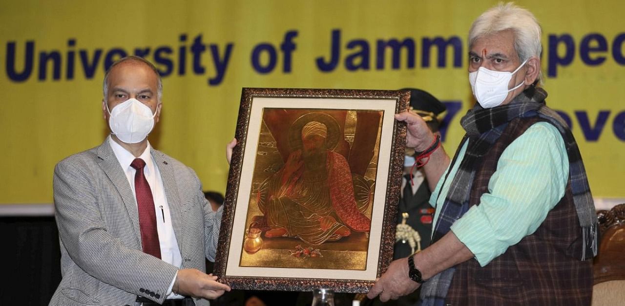 J&K Lieutenant Governor Manoj Sinha being greeted during the inauguration of Guru Nanak Dev's Chair at the University of Jammu. Credit: PTI Photo