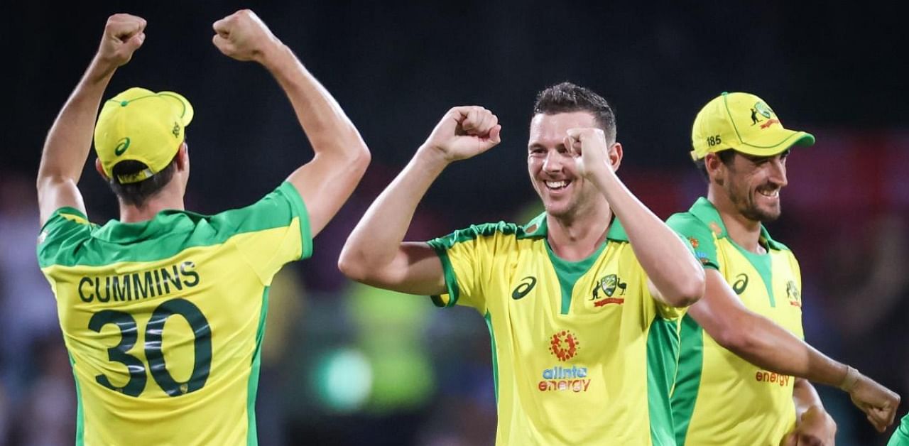 Australia’s Josh Hazlewood (C) celebrates with teammates after taking the wicket of India’s Shreyas Iyer during the one-day international cricket match at the Sydney Cricket Ground (SCG) in Sydney. Credit: AFP.