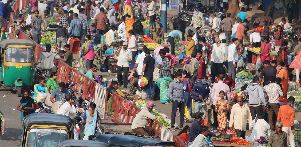 People throng a vegetable market, amid the coronavirus pandemic, in Surat. Credit: PTI Photo