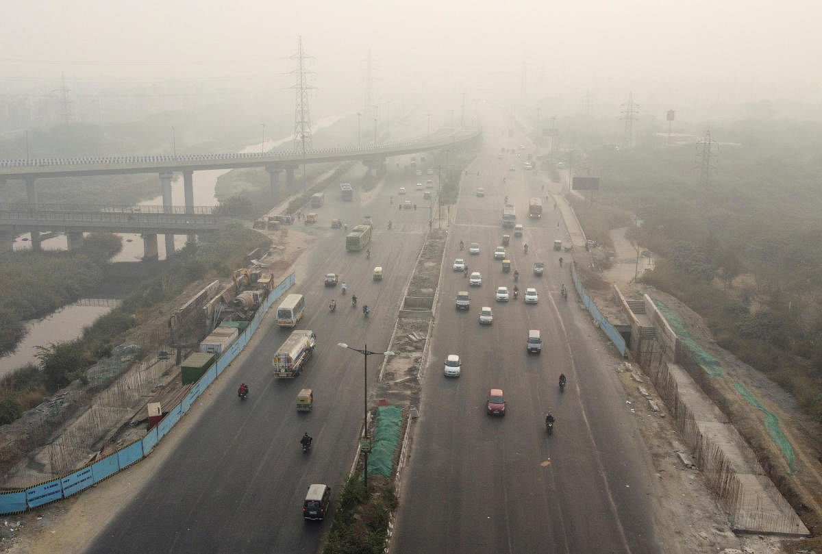 raffic moves along a highway shrouded in smog in New Delhi, India, November 15, 2020. Credit: REUTERS