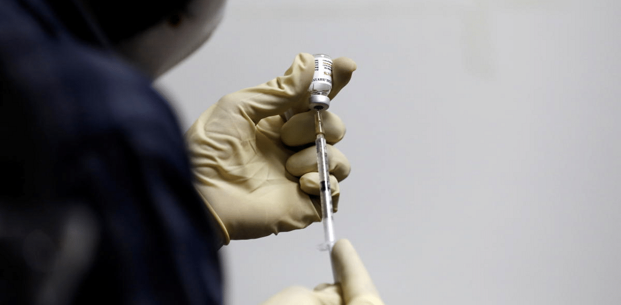 A medic fills a syringe with Covaxin, an Indian government-backed experimental Covid-19 vaccine. Credit: Reuters Photo