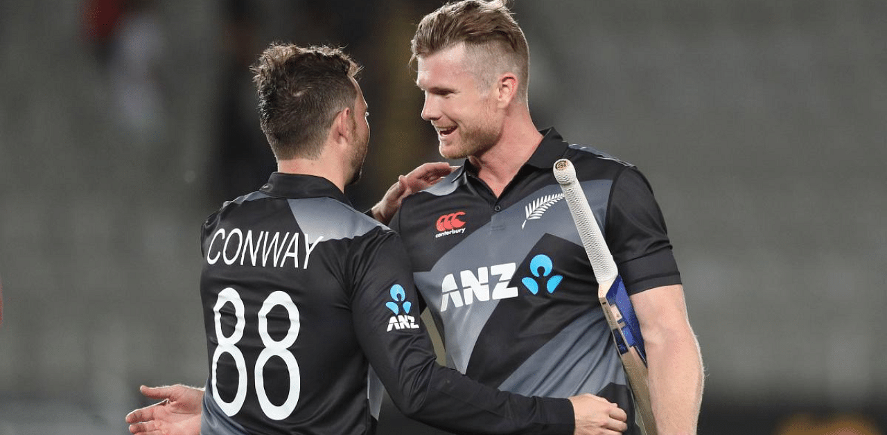 New Zealand’s James Neesham (R) and Devon Conway (L) celebrate their victory during the Twenty20 international cricket match between New Zealand and the West Indies at Eden Park in Auckland. Credit: AFP Photo