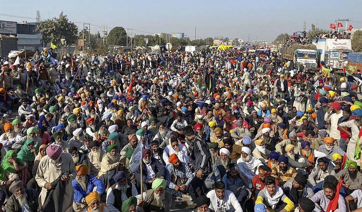 Farmers gathered at the Singhu border as part of their "Delhi Chalo" protest against Centre's new farm laws, in New Delhi. Credit: PTI