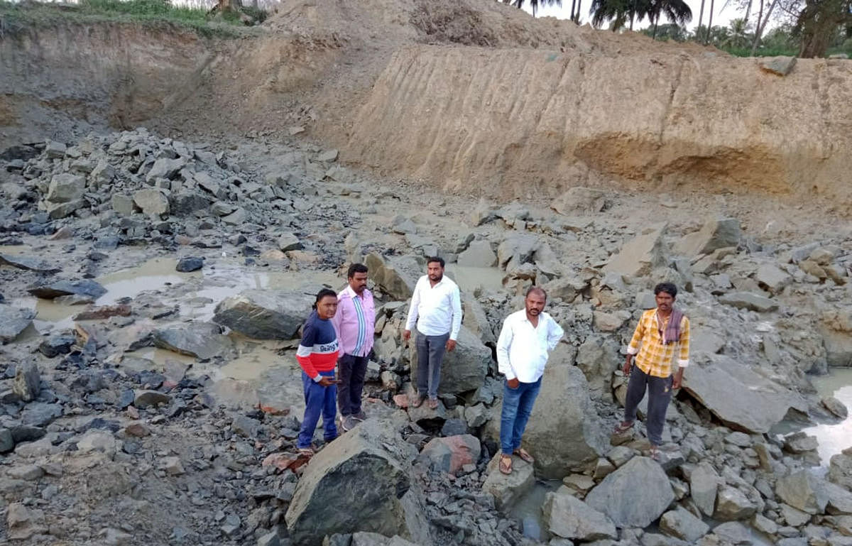 People visit spot where a boulder was blasted at Ganjam near Srirangapatna in Mandya district on Saturday. DH PHOTO