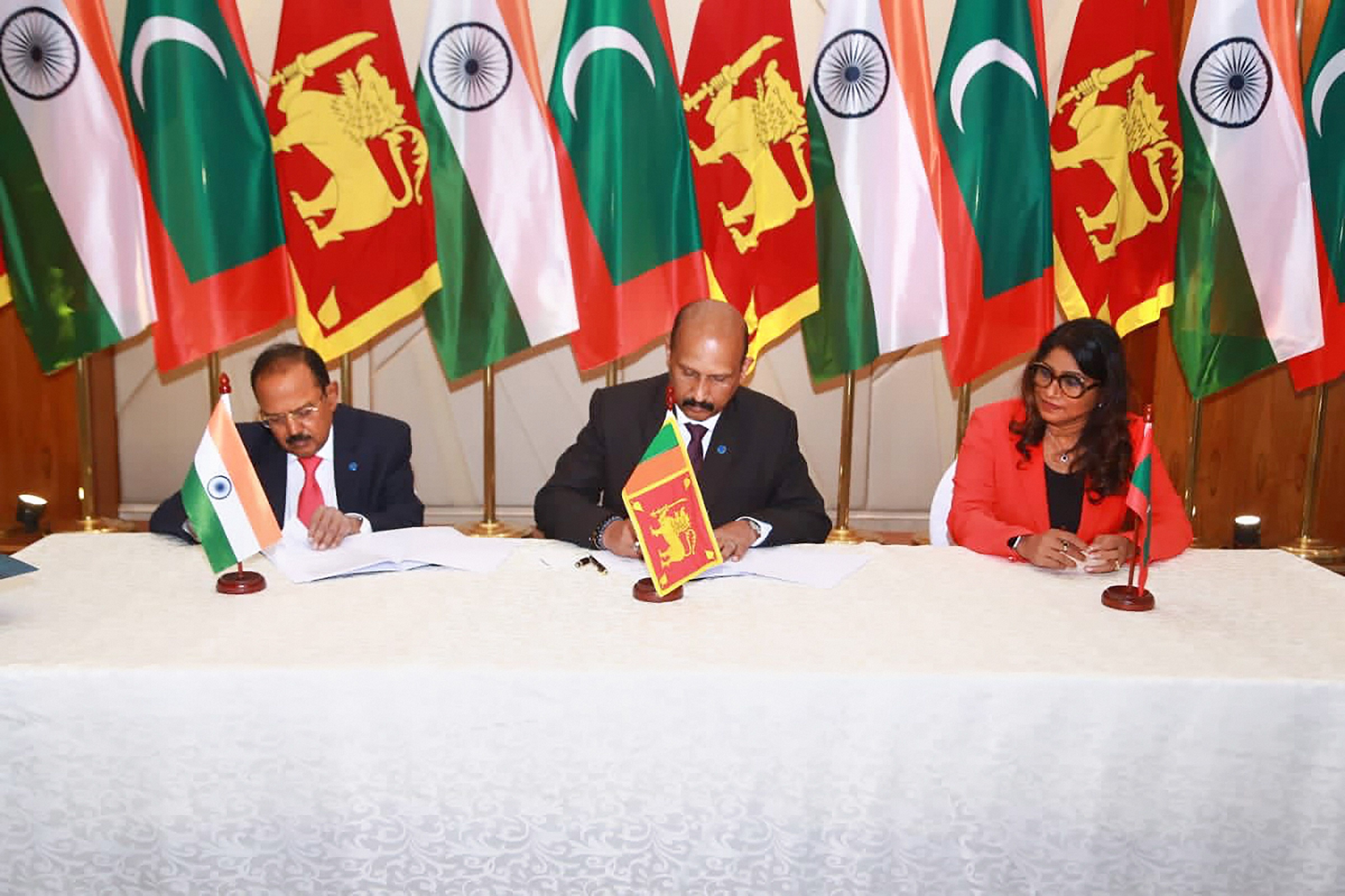 NSA Ajit Doval, Sri Lankan Defence Secretary Major General (Retd) Kamal Gunaratne and Maldives Foreign Minister Mariya Didi during signing of minutes after a trilateral meeting on maritime security cooperation between the nations. Credit: Twitter/@IndiainSL