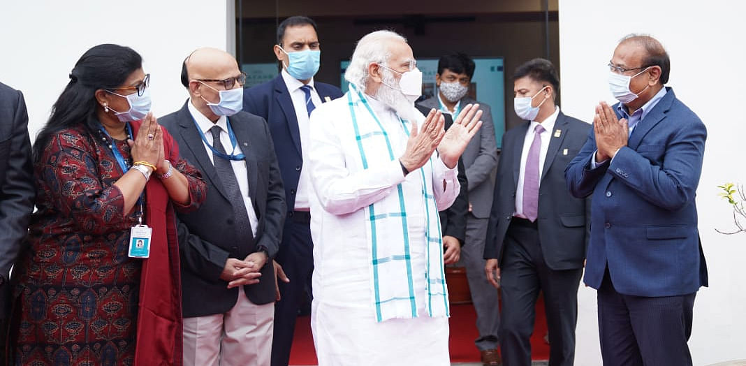 PM Modi with Bharat Biotech CMD Krishna Ella and others at the company's facility in Genome Valley, Hyderabad. Credit: Special Arrangement