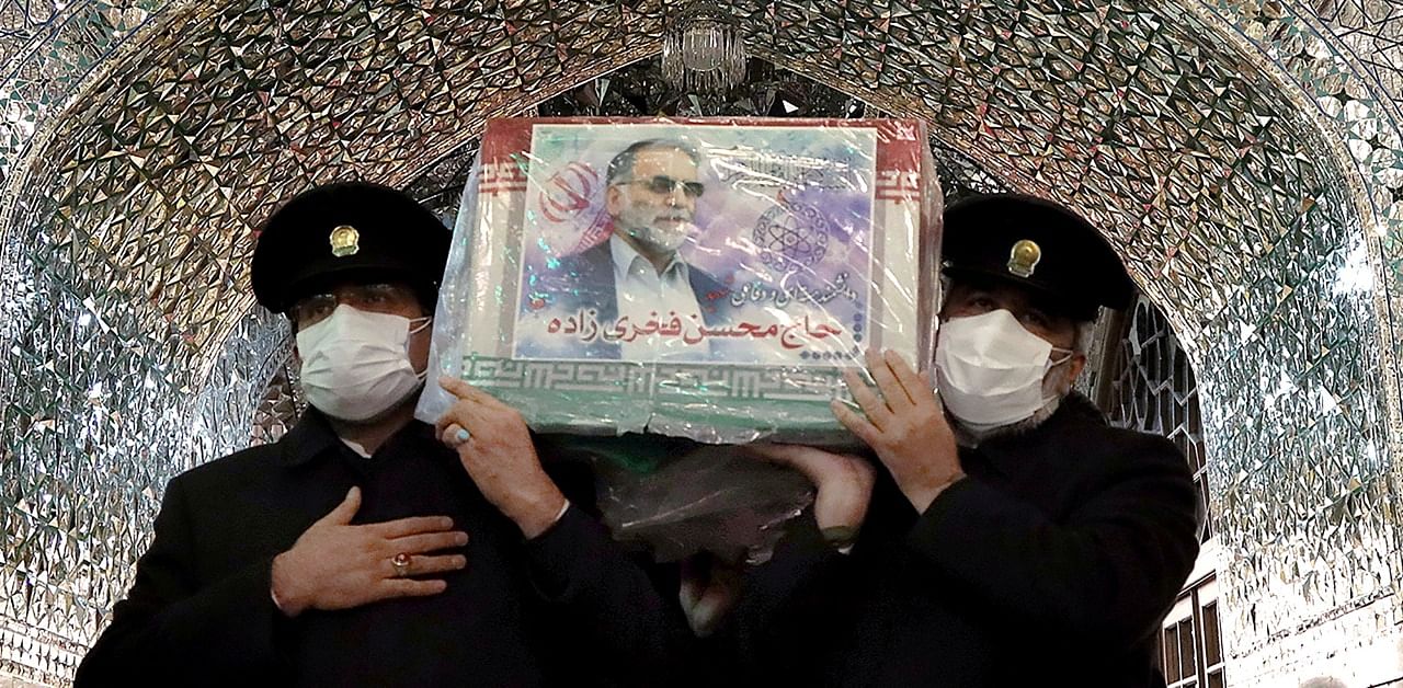 Servants of the holy shrine of Imam Reza carry the coffin of Iranian nuclear scientist Mohsen Fakhrizadeh, in Mashhad, Iran. Credit: Reuters Photo