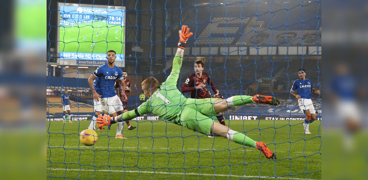 Leeds United's Raphinha scores their first goal as Everton's Jordan Pickford attempts save. Credit: Reuters Photo