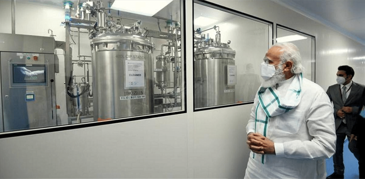 Prime Minister Narendra Modi at Serum Institute of India, during his 3 city visit to review Covid-19 vaccine development work, in Pune. Credit: PTI
