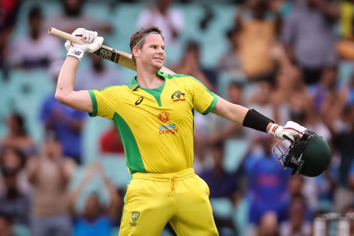 Australia's Steve Smith celebrates after reaching his century during the one-day cricket match against India at the Sydney Cricket Ground (SCG) in Sydney. Credit: AFP